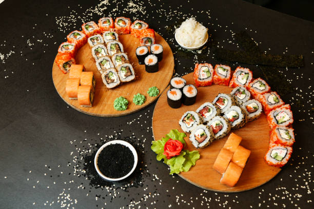 istock Two Plates of Sushi on Black Table 2022856780