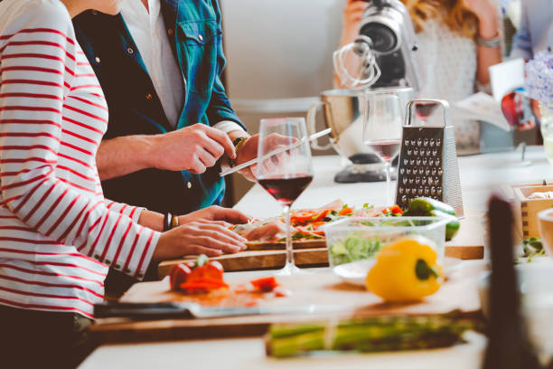 istock Couple preparing pizza, close up of hands 2022859921