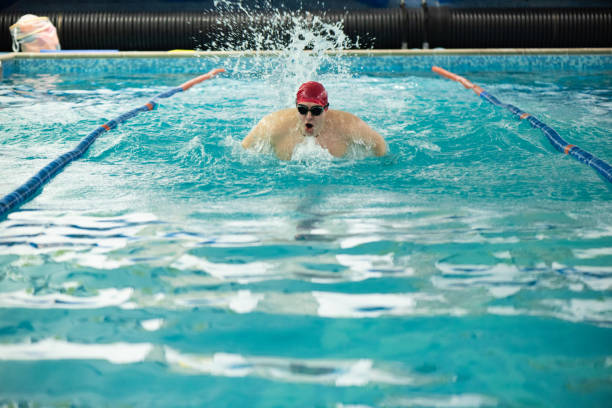 Race of backstroke swimmers in the pool