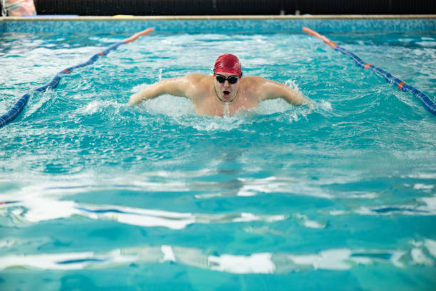 Low Section Of Woman Swimming In Pool