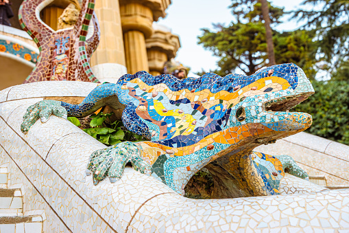 Barcelona, Gaudi Parc Guell colorful mosaics. Lizard statue. Spanish catalan moderniste architecture and art