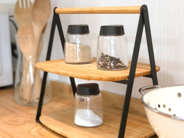 istock A warm home kitchen is decorated with cooking utensils and spices for cooking. Placed on the shelf, it looks beautiful and simple. 2022869740