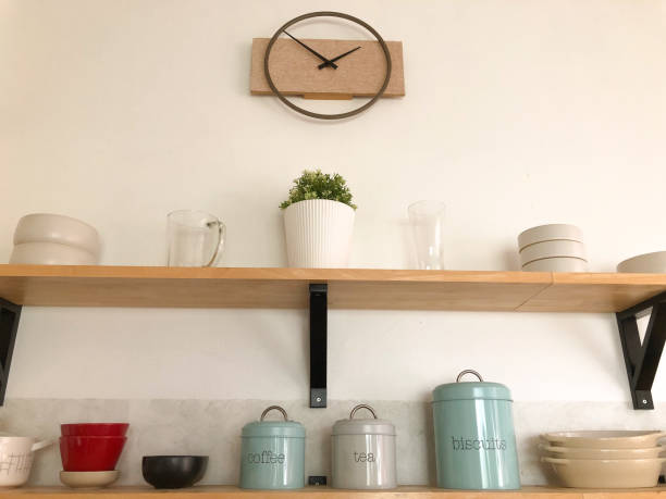 istock A warm home kitchen is decorated with cooking utensils and spices for cooking. Placed on the shelf, it looks beautiful and simple. 2022869842