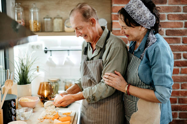 istock Senior couple cooking together at home 2022875948