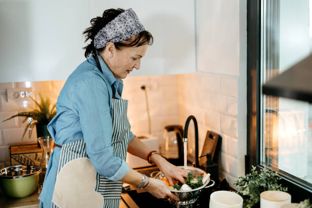 istock An elderly woman in the kitchen 2022885081