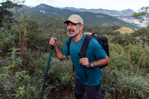 istock Senior man hiking through the forest 2022886142