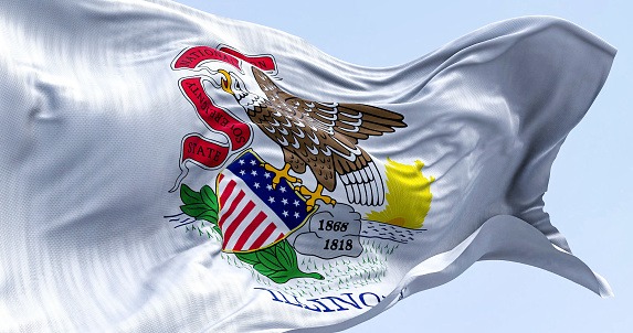 Close-up of the Illinois state flag waving in the wind on a clear day. Seal of Illinois against a white backdrop with the word Illinois below. 3d illustration render. Rippling fabric