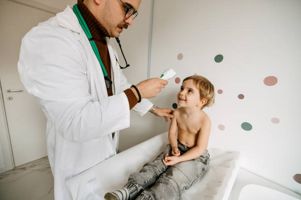 istock Pediatrician measuring the temperature 2022890045