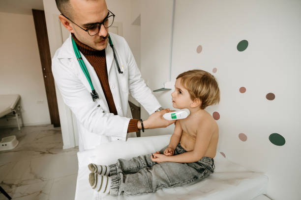 istock Pediatrician measuring the temperature 2022890595