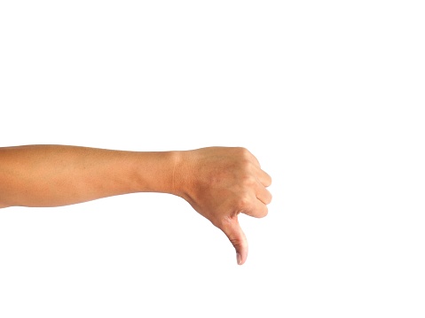 Male hands making a dislike gesture isolated on white background.