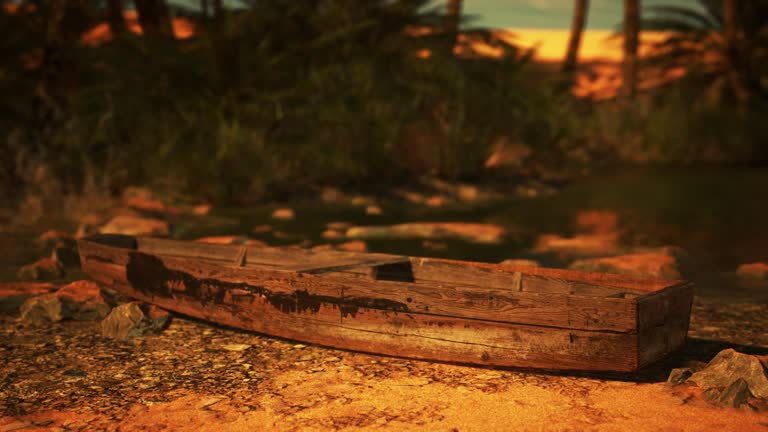 A wooden boat sitting on top of a dirt field