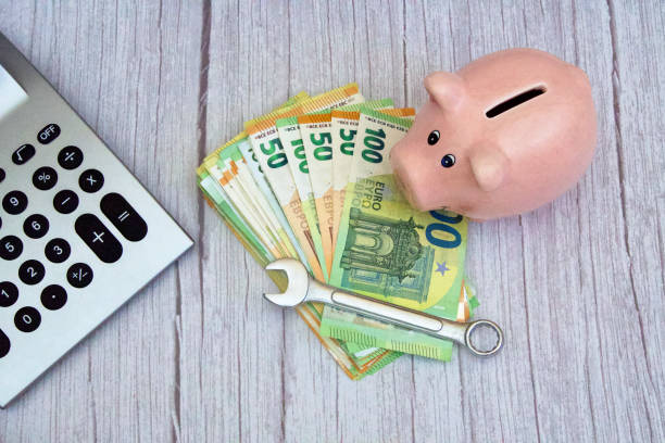 istock stack of banknotes with a wrench, calculator and piggy bank 2022966816