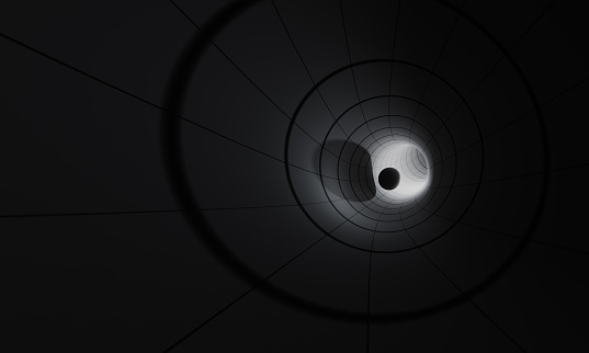 Black sphere travelling inside of a tunnel. Horizontal composition.