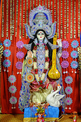 Idol of Goddess Devi Saraswati at a decorated puja pandal in Kolkata, West Bengal, India on February 14, 2024. Saraswati Puja is a popular religious festival of Hinduism.