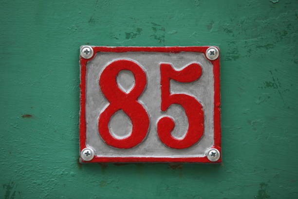 Vintage square ceramic street number plate with number. Close up, brand.