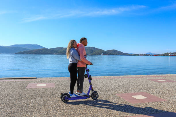 hispanic guy with rental e-scooter. - turkey black sea coast photos et images de collection