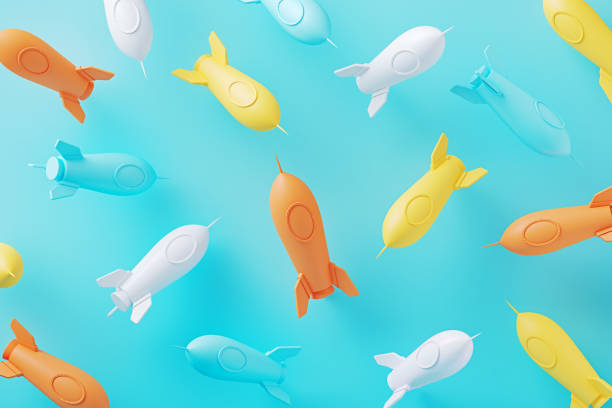 Colorful toy rocket ships  on blue background. Horizontal composition.