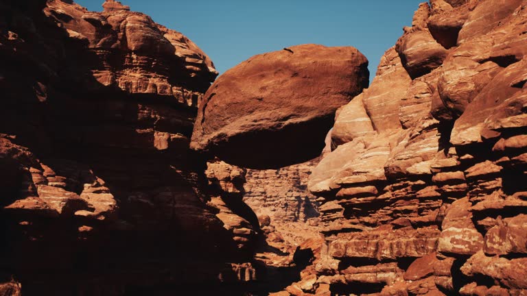 A large rock formation in the middle of a desert