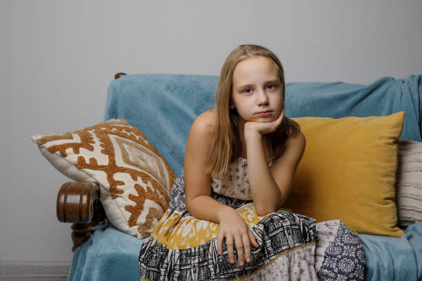 istock Tired girl relaxing on the sofa at home 2023006427
