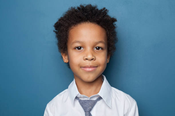 istock Young kid on blue background, portrait 2023006431
