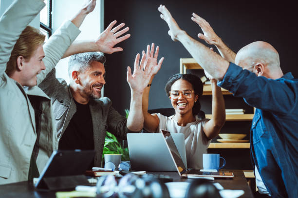 istock Group of People Raising Hands in Teamwork 2023019674