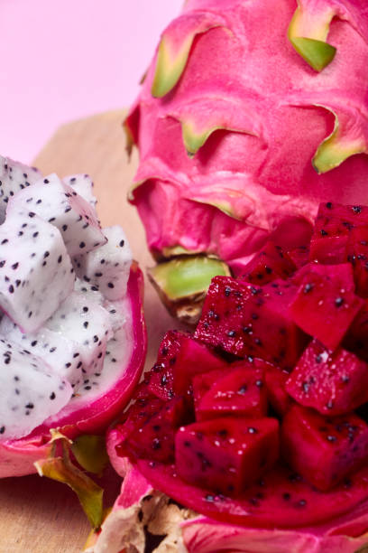 istock Red dragon fruit Set with appetizing serving on pink background. Top view 2023032397