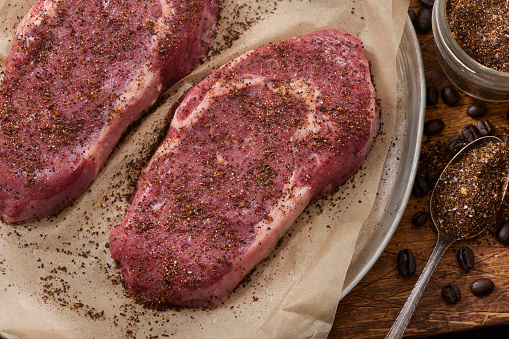 Preparing Coffee Dry Rubbed Boneless Rib Eye Steaks with coffee, paprika, garlic and onion powder, salt, pepper and cumin