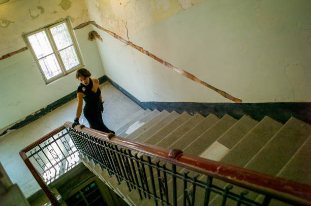 Fashion model in various poses in abandoned indoor place
