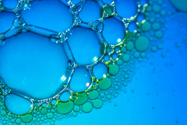 istock Oil drops and bubbles floating over water with blue background 2023047139
