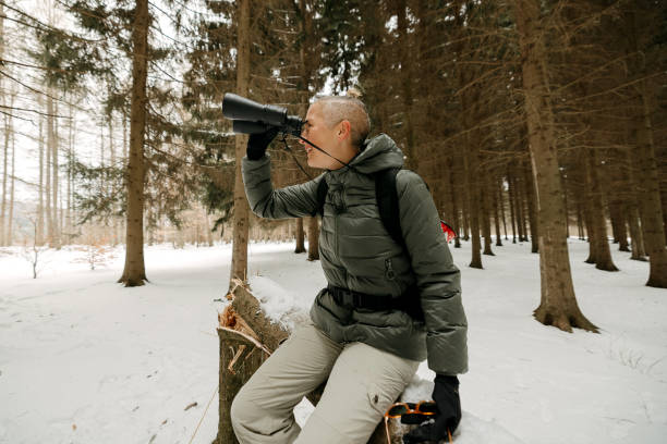 istock Woman looks through binoculars 2023062713