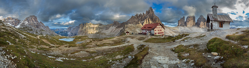 Alpe di Siusi or Seiser Alm with Sassolungo, Langkofel mountain group in background. Alpe di Siusi or Seiser Alm, Sassolungo and Sassopiatto mountains, Trentino Alto Adige, Sud Tyrol, Italy, Europe.