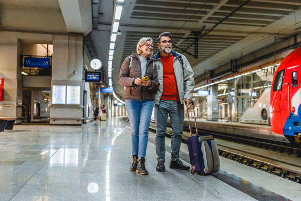 istock Mature couple at railway station 2023084310