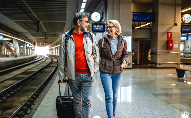 istock Mature couple at railway station 2023084845