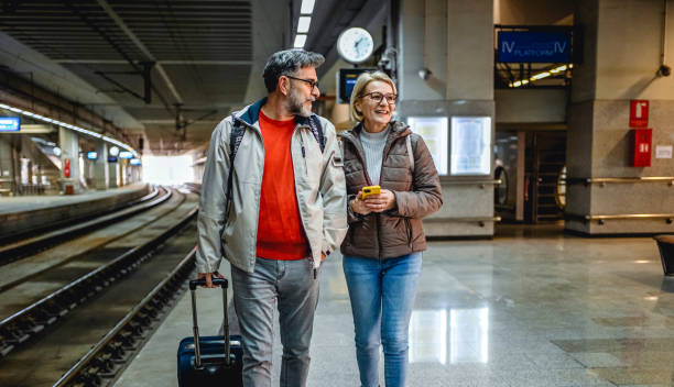 istock Mature couple at railway station 2023086570