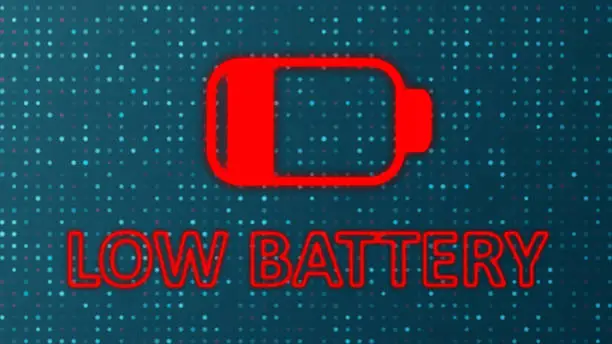 Photo of Low Battery text and Abstract Battery Charging Icon form lines and triangles, point connecting network on background.