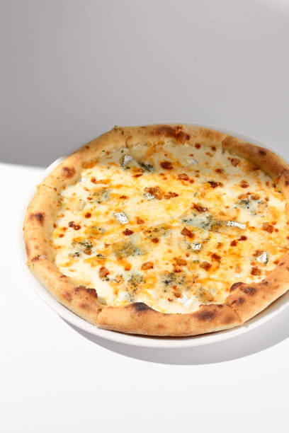 istock Italian Quattro Formaggi Pizza with Four Cheeses on White with Shadow 2023147746