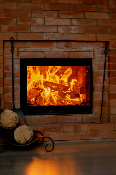 istock firewood is burning brightly in the brick fireplace 2023157738