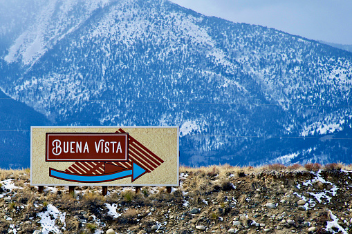 Buena Vista, Colorado, USA - February 10, 2024: A sign welcomes visitors to the town of Buena Vista in the Rocky Mountains on a winter afternoon.