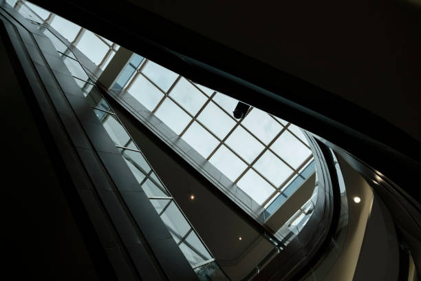 istock Modern glass staircase and cutout ceiling 2023162965
