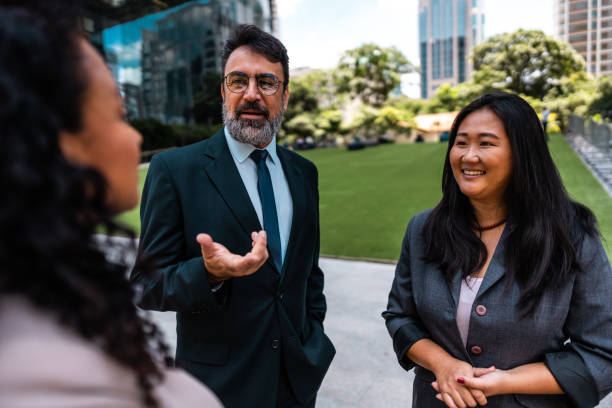 istock Coworkers talking in the street 2023187995