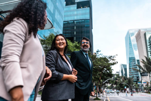 istock Coworkers talking in the street 2023189620