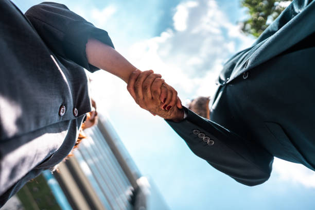 istock Business people handshaking outdoors 2023190145