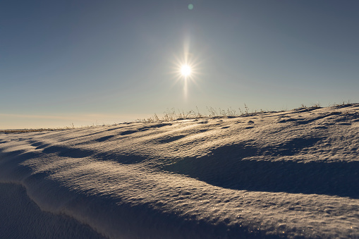 drifts of white pure snow after a snowfall, beautiful white snow in the field in winter in sunny weather