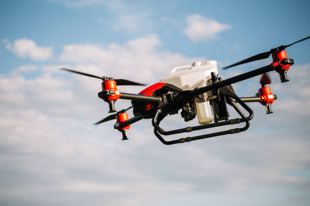 istock agricultural drone on a background of blue sky. 2023247790