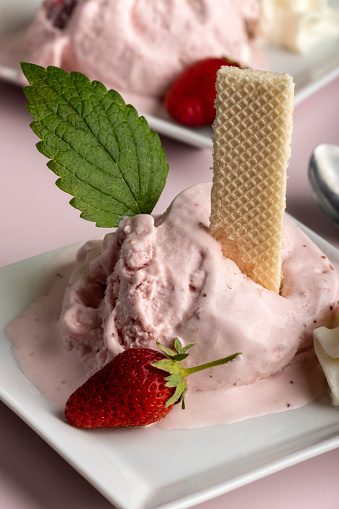 closeup of strawberry ice cream with waffle