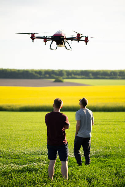 istock Technician farmer use wifi computer control agriculture drone on sugarcane field. 2023254306