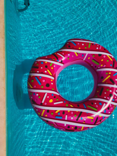 istock A pink doughnut in the pool 2023268525