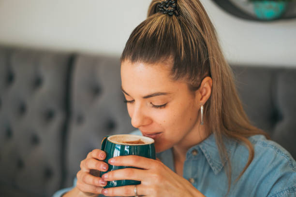 istock A beautiful woman enjoying the moment while drinking coffee in the cafeteria 2023273219