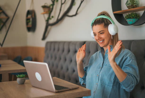 istock Beautiful young woman having video call 2023282780