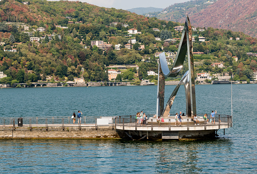 Como, Lombardy, Italy - September 5, 2022:The Life Electric is a stainless steel sculpture by Daniel Libeskind located in Como, on the breakwater of the Lake Como.